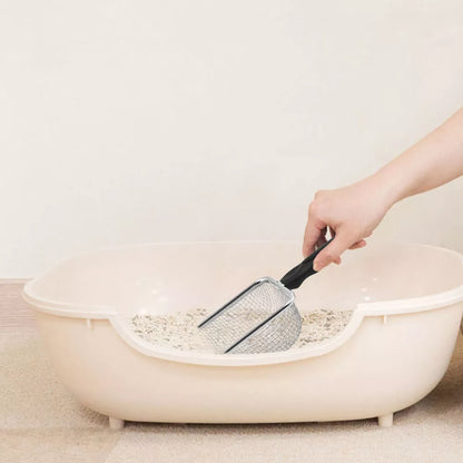 Pelle à litière ramassant litière